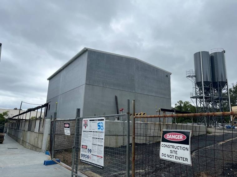 A building under construction with a sign

AI-generated content may be incorrect.