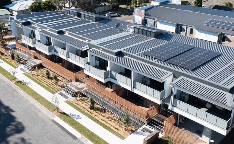 A building with solar panels on the roof

AI-generated content may be incorrect.